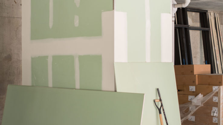 A close-up image of ToughRock Mold Guard wall panels installed in a moisture-prone space, such as a bathroom, basement, or laundry room. The panels showcase a smooth surface designed to resist mold growth and provide durable, long-lasting protection. Suitable for high-humidity environments